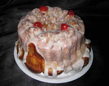 Iced Pull-a-Part coffee cake topped with cherries