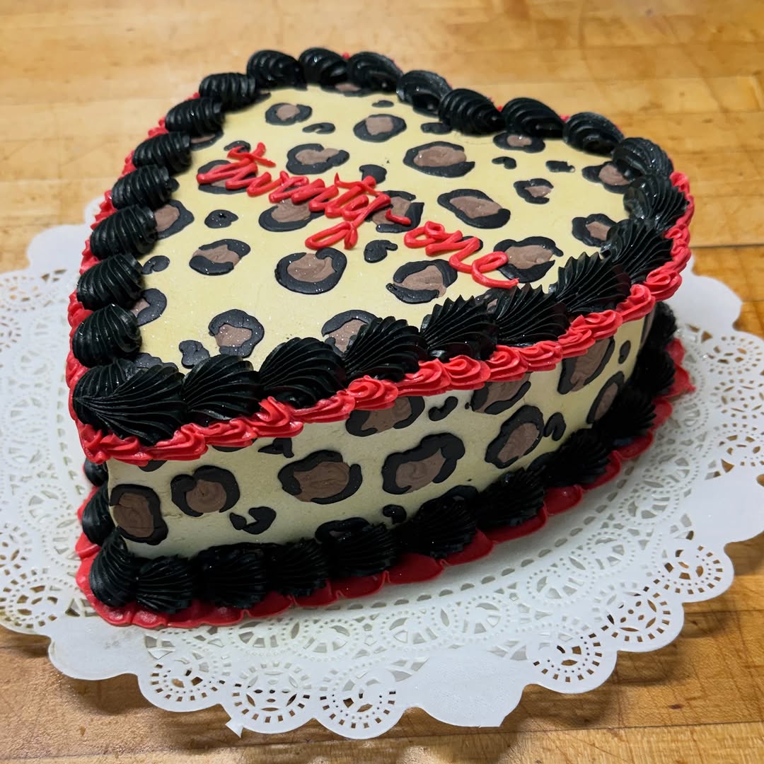 Heart-shaped leopard-print birthday cake